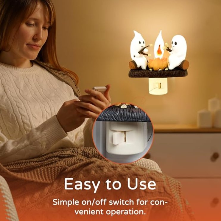 Ghost-shaped LED campfire nightlight with flickering effect, creating a spooky, cozy atmosphere perfect for Halloween or any eerie setting.