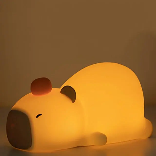 Capybara Glow Night Lamp, a cute and cozy animal-shaped night light emitting a soft, warm glow, perfect for creating a relaxing atmosphere in any room.