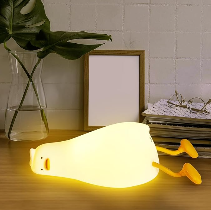 Battery-operated lying flat duck night lamp for versatile placement