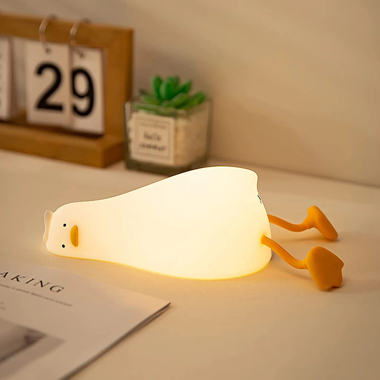 Lying flat duck night light with an adorable design for kids' rooms