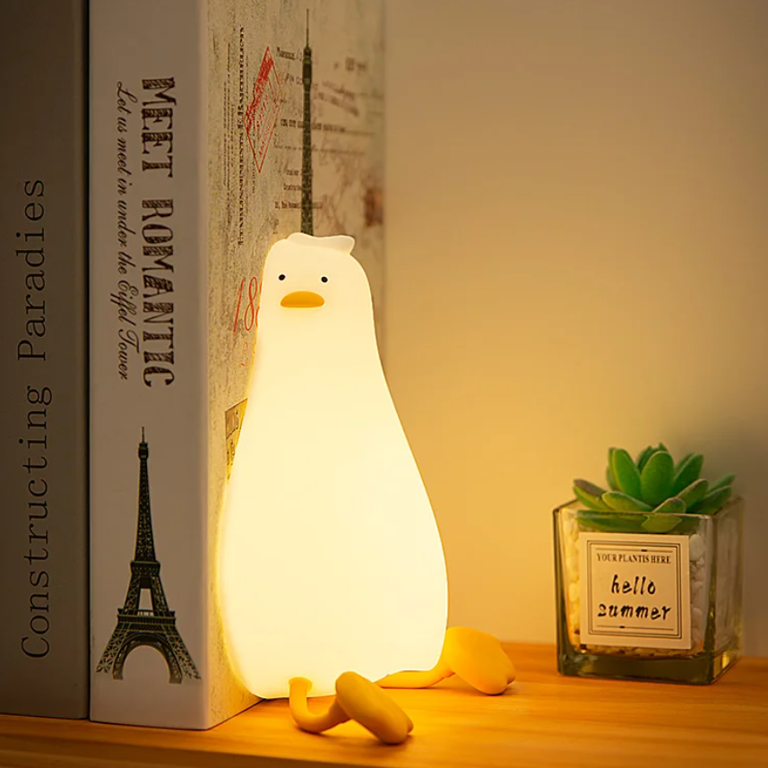 Flat lying duck lamp providing gentle illumination for children